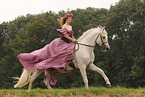 woman is riding a Pura Raza Espanola