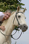 woman rides Quarter Horse