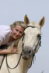 woman rides Quarter Horse