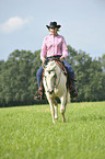 woman rides Quarter Horse