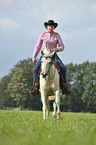 woman rides Quarter Horse