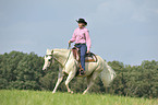 woman rides Quarter Horse