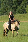 woman rides Quarter Horse