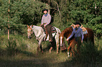 humans with dog and horse