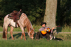 man with dog and horse