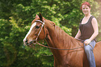 woman rides Quarter Horse