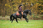 woman rides Quarter Horse