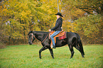 woman rides Quarter Horse