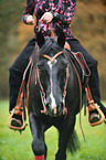 woman rides Quarter Horse