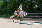 woman rides Quarter Horse