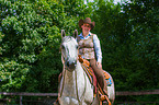 woman rides Quarter Horse