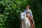 woman rides Quarter Horse