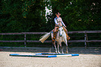 woman rides Quarter Horse