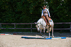 woman rides Quarter Horse