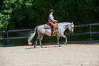 woman rides Quarter Horse