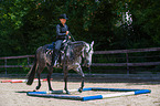 woman rides Quarter Horse