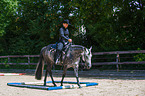 woman rides Quarter Horse