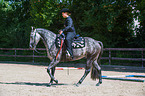 woman rides Quarter Horse