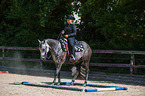 woman rides Quarter Horse
