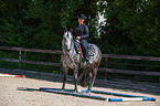 woman rides Quarter Horse