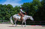 woman rides Quarter Horse