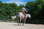 woman rides Quarter Horse