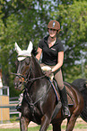 woman rides horse