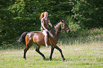 woman rides warmblood
