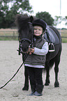 girl and Shetlandpony