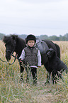 girl and Shetlandpony