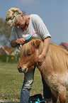 woman and Shetland Pony stallion