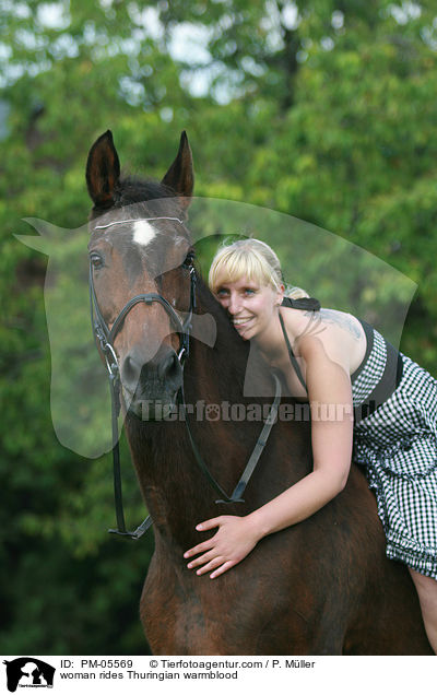 woman rides Thuringian warmblood / PM-05569