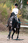 woman rides Trakehner