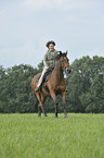 woman rides Trakehner