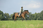 woman rides Trakehner