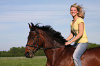 woman rides trotter