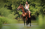 woman rides trotter