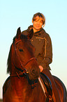 woman rides warmblood
