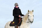 woman rides warmblood