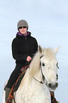 woman rides warmblood