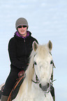 woman rides warmblood