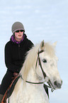 woman rides warmblood