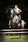 woman rides warmblood