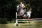 woman rides warmblood