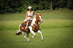 woman rides warmblood