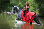 woman rides warmblood