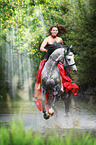 woman rides warmblood