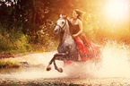 woman rides warmblood