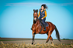 woman rides warmblood