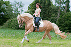 woman rides warmblood